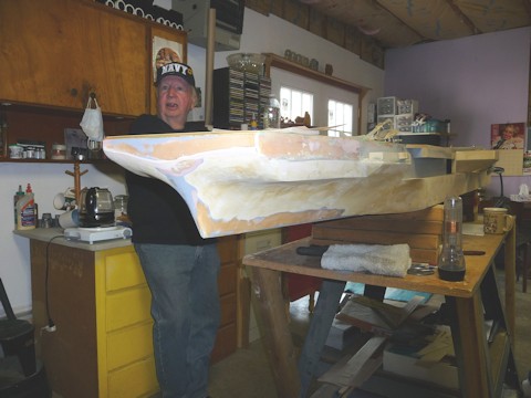 Bow section rebuild under an Oriskany crewman's oversight